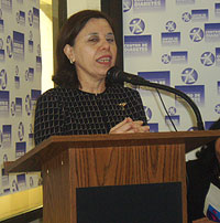 Dr. Emma Fernández-Repollet during her message to the public that attended the activity